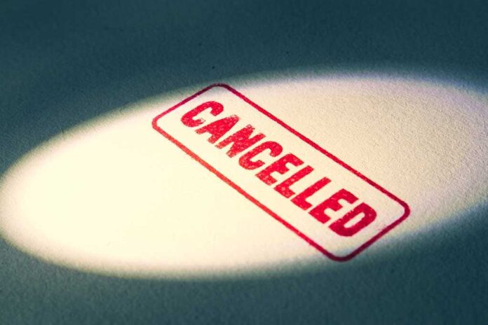 1898060764 featured image Red "Cancelled" stamp under a spotlight.