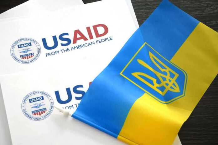 2261440513 featured image USAID documents with Ukrainian flag on table