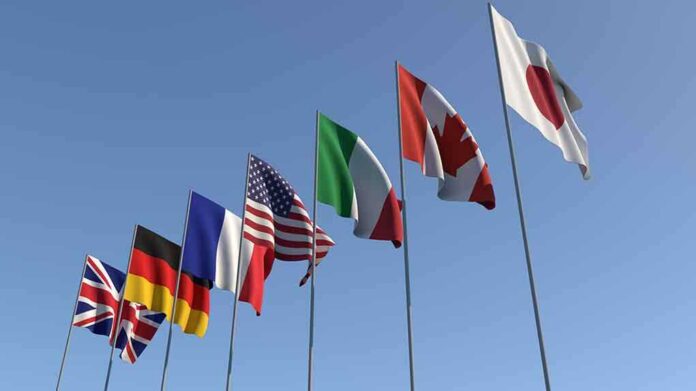 1437085796 featured image Flags of seven countries against clear blue sky.