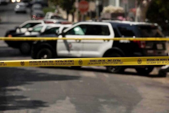1980603047 featured image Police tape blocking street with patrol cars.