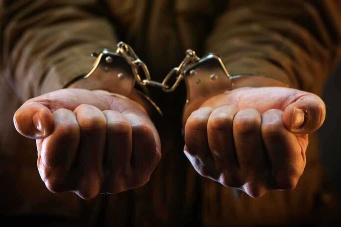536624479 featured image Hands in handcuffs, close-up view.