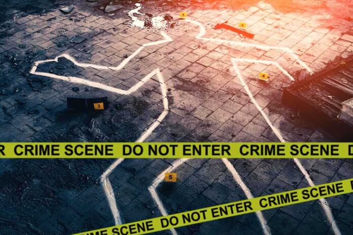 1478788715 featured image Chalk outline at a crime scene with evidence markers.