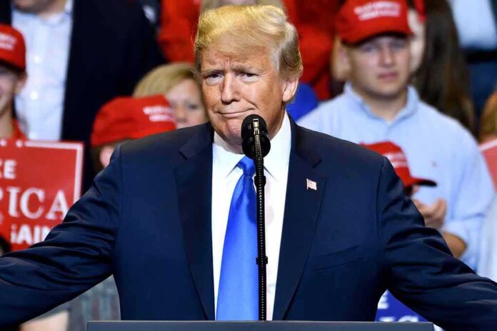 1690696369 featured image Man in suit speaking at a rally.
