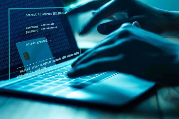 1107463670 featured image Hands typing on laptop with security overlay display