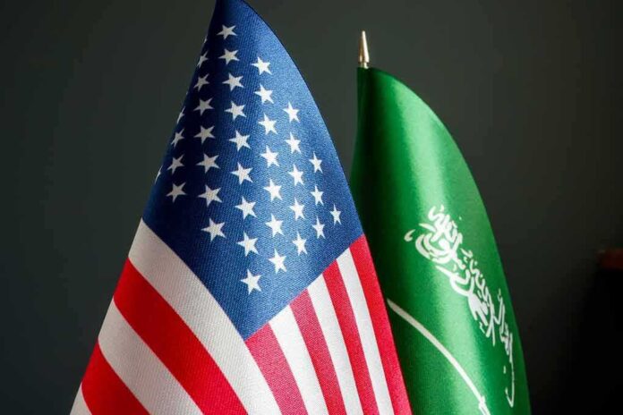 2156698495 featured image American and Saudi Arabian flags side by side