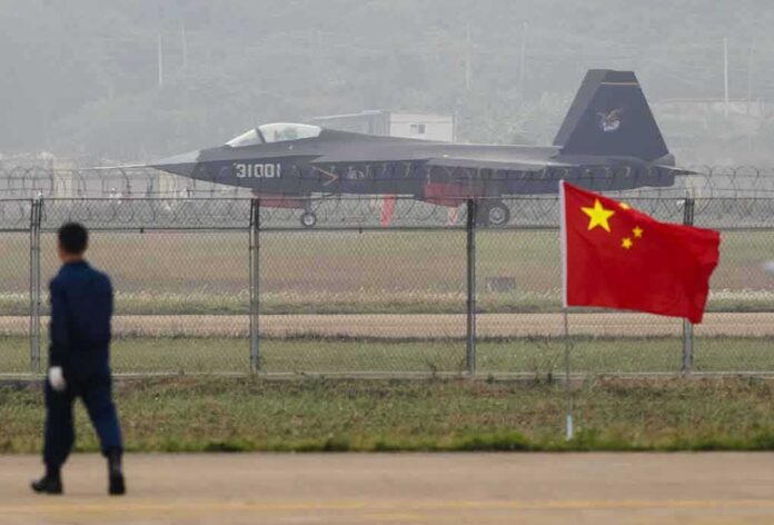 231381238 featured image Jet with marking behind barbed wire fence