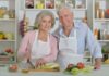 Elderly couple cooking together in the kitchen