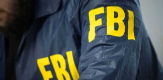 FBI agent wearing a jacket with yellow letters