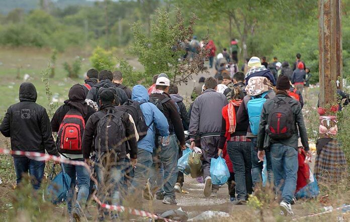 767062555 featured image People walking on a path carrying bags outdoors