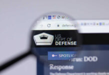 Magnifying glass focusing on US Department of Defense website