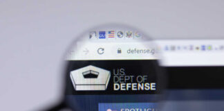 Magnifying glass focusing on US Department of Defense website