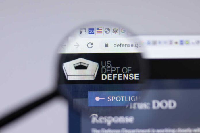 US Dept of Defense logo close-up on website page_1963403443.jpg featured image Magnifying glass focusing on US Department of Defense website