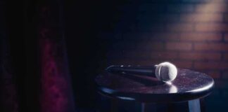Microphone resting on a stool on stage