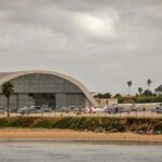 Aircraft hangar with helicopters near the beach