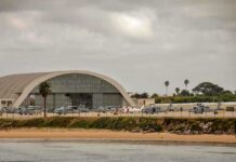 Aircraft hangar with helicopters near the beach