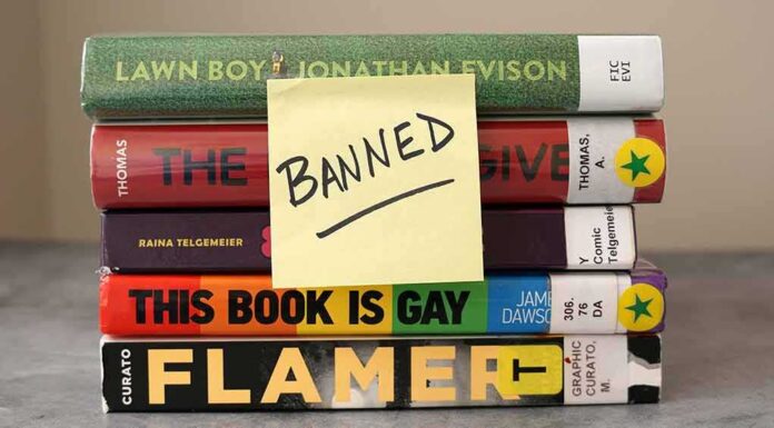 2315893787 featured image Stack of banned books with a sticky note