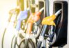 Colorful gas pump nozzles at a station