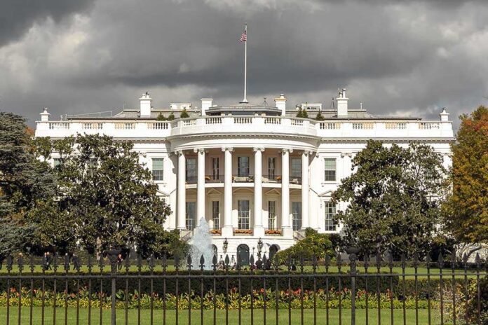 560339335 featured image The White House with overcast sky and flag raised