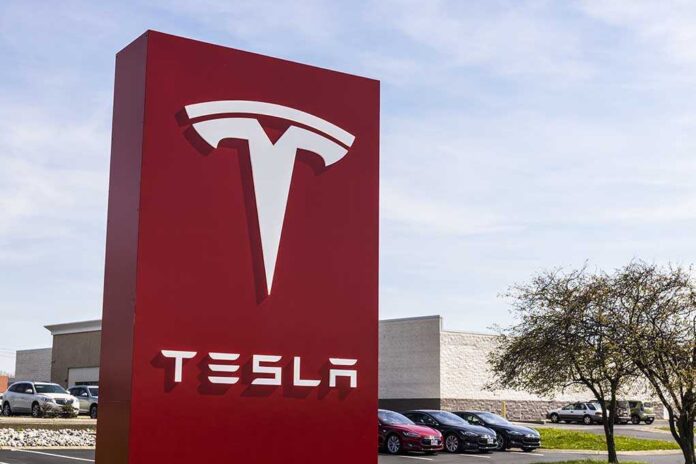 Tesla sign in front of dealership