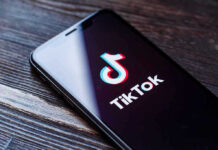 Phone screen showing TikTok logo and app
