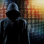 Hooded figure with binary code background