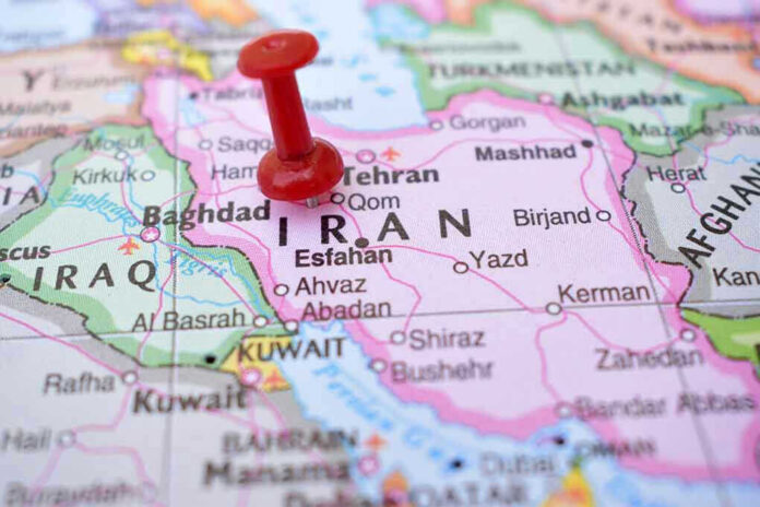 2237379503 Red pushpin marking Iran on a map