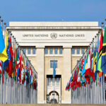 United Nations building with numerous national flags outside