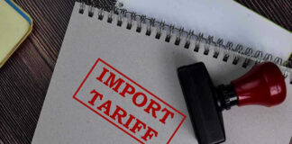 Notebook with Import Tariff stamp and rubber stamper.