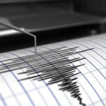 EARTHQUAKE DEVASTATES Philippines — Millions Powerless After Nightmare! Seismograph needle recording earthquake activity on paper.
