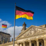 Oktoberfest HALTED — Explosion Rocks Munich! German flags at the Reichstag building in Berlin.