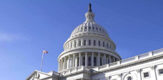 The U.S. Capitol building with a clear blue sky in the background