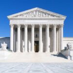 SCOTUS Attack Foiled — Active Bomber Arrested On Site! The Supreme Court building featuring marble columns and a clear blue sky