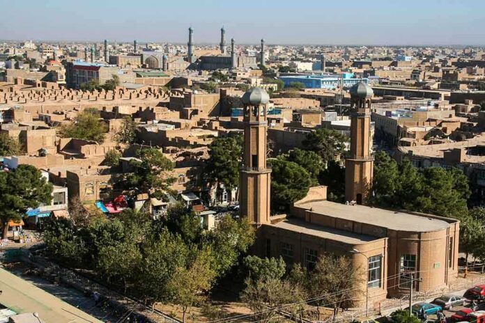 Aerial view of a city featuring traditional buildings and minarets