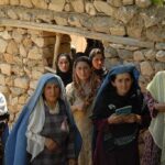 Terror Rampage SHATTERS Yom Kippur Worship – Multiple DEAD! Group of women in traditional clothing standing in front of a stone wall