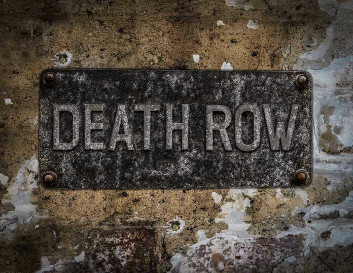 533872477 Weathered Death Row sign on aged concrete wall