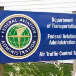 FAA STOPS Controversial Musk Launches! Sign for the Federal Aviation Administration at an air traffic control tower
