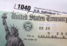 Trump Child Accounts SKYROCKET, But With One Catch! Close-up of a U.S. Treasury check and tax form 1040