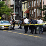 Mother MURDERS 6-Day-Old Baby and Husband! Police gathered at an urban crime scene.