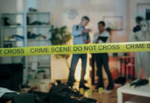 Gay Couple Abused, KILLED Adopted Child! Crime scene with tape and investigators examining evidence.