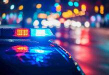 NBA Star ARRESTED During NBA Finals! Police car with flashing lights at night.