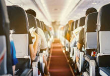 Airplane Passengers DISGUSTING Toenails Spark Outrage! Passengers seated inside an airplane cabin.