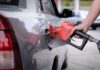 Gas Price SKYROCKETS Approaching 250th Celebrations! A person refueling a car at a gas station