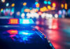 Three Time Deported Illegal Murders 6-Year-Old Girl! Police car with flashing lights at night.