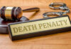 State Makes Firing Squad Primary Execution Method! Gavel, handcuffs, and Death Penalty sign on desk.