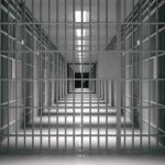 Last-Minute Gender Change BACKFIRES – Judge Slams Door empty prison corridor with barred cells