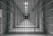Last-Minute Gender Change BACKFIRES – Judge Slams Door empty prison corridor with barred cells