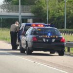 Hot-Car Horror: STONED Father Neglects Baby Police officer conducting a traffic stop on a highway