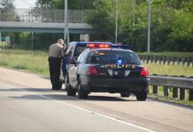 Hot-Car Horror: STONED Father Neglects Baby Police officer conducting a traffic stop on a highway