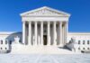 Justice Barrett Flips AGAIN – Roils The Right The Supreme Court building featuring marble columns and a clear blue sky