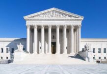 Justice Barrett Flips AGAIN – Roils The Right The Supreme Court building featuring marble columns and a clear blue sky